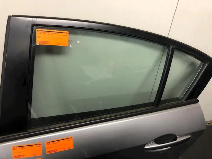 Rear door window 4-door, left Mazda 3.