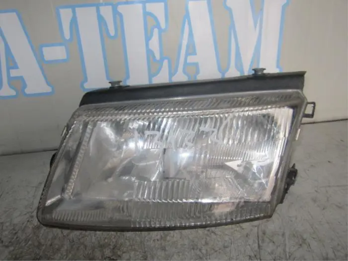 Headlight, left Volkswagen Passat